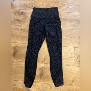 Black leopard cotton high rise legging with mesh detail on bottom of legs